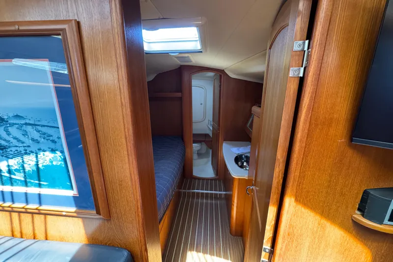 Interior of 2004 Hunter 41 Aft Cockpit yacht, featuring cozy cabin and wooden finishes.