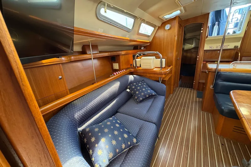 Luxurious interior of 2004 Hunter 41 Aft Cockpit yacht with elegant wood finish.