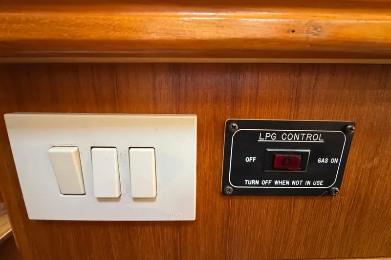 Control panel with LPG switch and light switches on a 2004 Hunter 41 Aft Cockpit yacht.