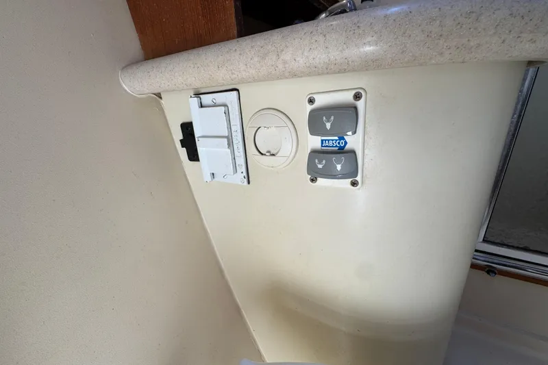 Control panel on 2004 Hunter 41 Aft Cockpit yacht with Jabsco switches.