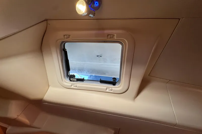 Interior view of a 2004 Hunter 41 Aft Cockpit yacht window with overhead light.