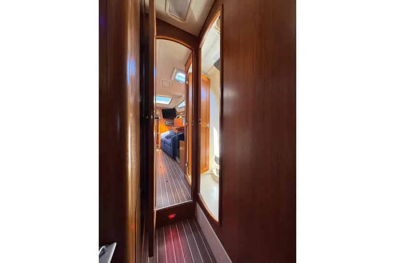 Interior view of 2004 Hunter 41 Aft Cockpit yacht, featuring wooden paneling and cozy cabin space.
