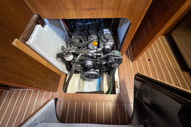 Engine compartment of 2004 Hunter 41 Aft Cockpit sailboat, showcasing mechanical components.