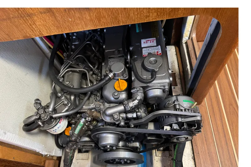 Engine compartment of a 2004 Hunter 41 Aft Cockpit sailboat, showcasing mechanical components.