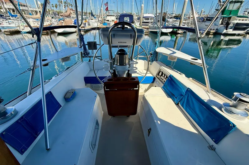 Cockpit of a 1988 Catalina 34 sailboat docked at a marina.