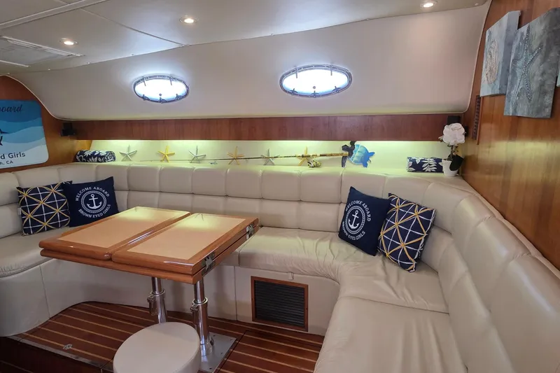 Luxurious interior of 2004 Tiara Yachts 4000 Express with plush seating and nautical decor.