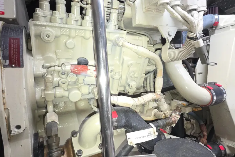 Engine compartment of a 2004 Tiara Yachts 4000 Express, showcasing detailed mechanical components.