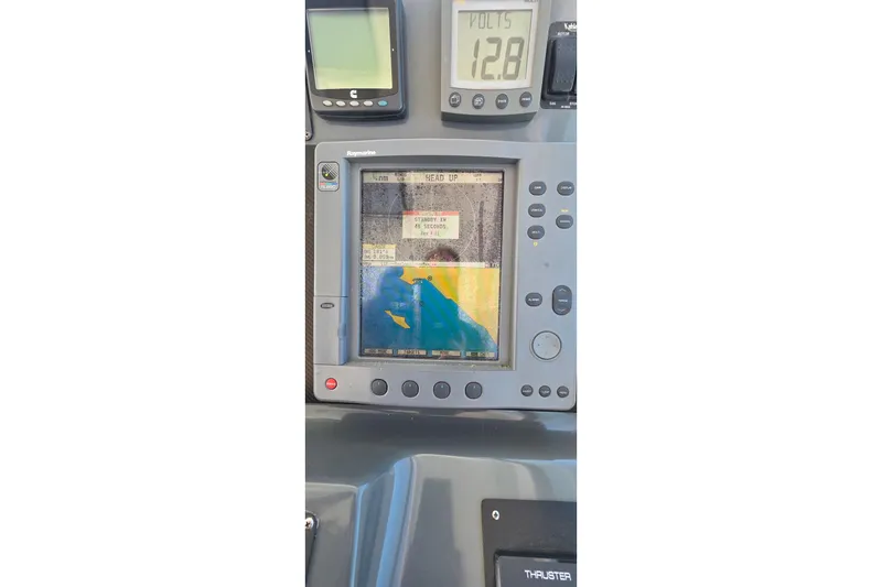 Navigation system on a 2004 Tiara Yachts 4000 Express, displaying marine chart and voltage.
