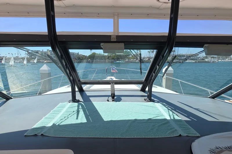 2004 Tiara Yachts 4000 Express interior view with marina backdrop.