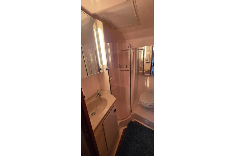 Bathroom interior of 2004 Tiara Yachts 4000 Express with shower and vanity.