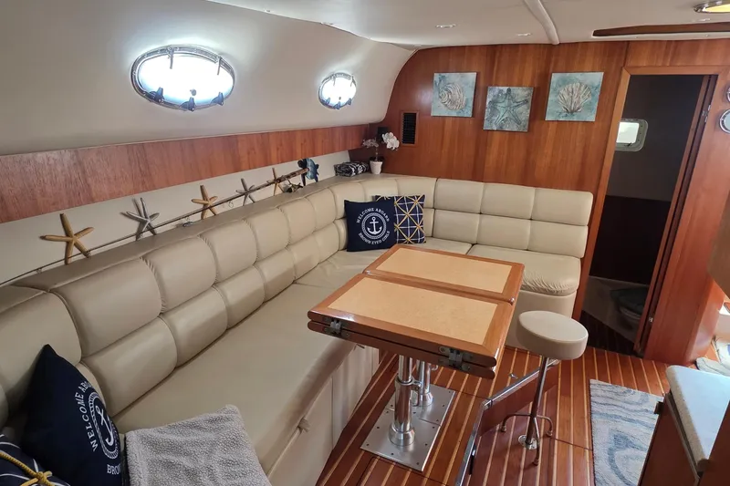 Luxurious 2004 Tiara Yachts 4000 Express interior with elegant seating and nautical decor.