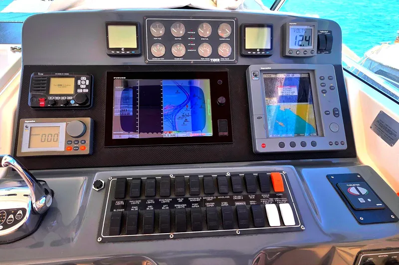 Control panel of a 2004 Tiara Yachts 4000 Express with navigation and communication equipment.