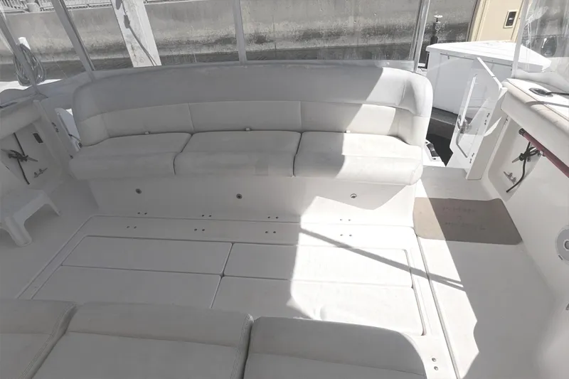 2004 Tiara Yachts 4000 Express interior with white seating and spacious deck area.