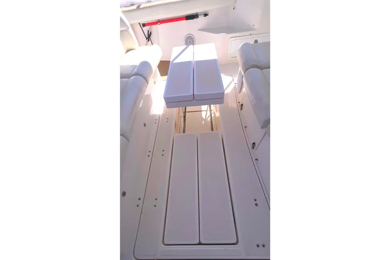 2004 Tiara Yachts 4000 Express deck with seating and table.