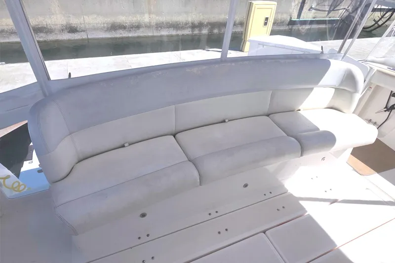 2004 Tiara Yachts 4000 Express boat seating area with cushioned bench.
