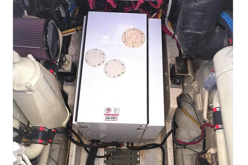 Engine compartment of a 2004 Tiara Yachts 4000 Express, showcasing mechanical components.