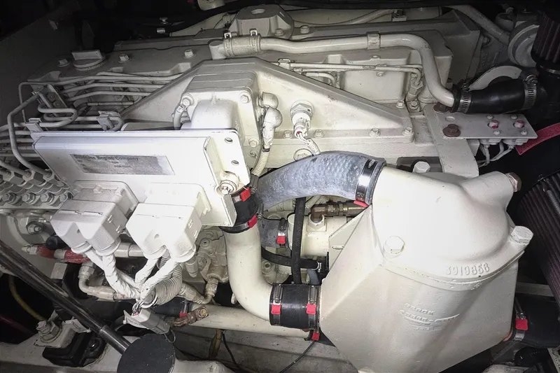 Engine compartment of a 2004 Tiara Yachts 4000 Express, showcasing detailed mechanical components.