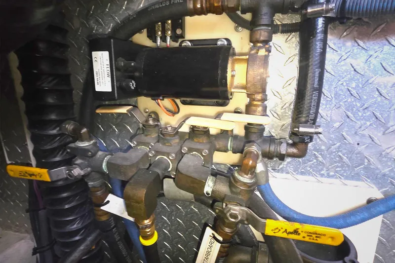 Engine room plumbing and valves of a 2004 Tiara Yachts 4000 Express.