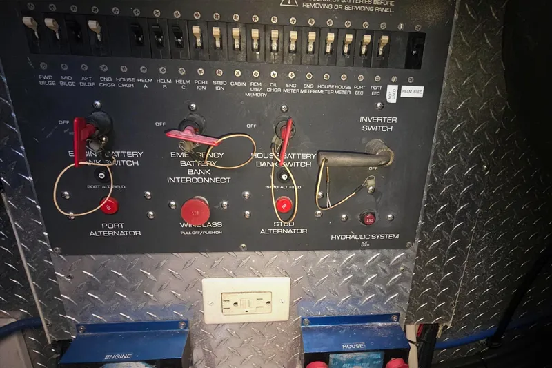 Control panel of a 2004 Tiara Yachts 4000 Express, featuring battery switches and alternators.