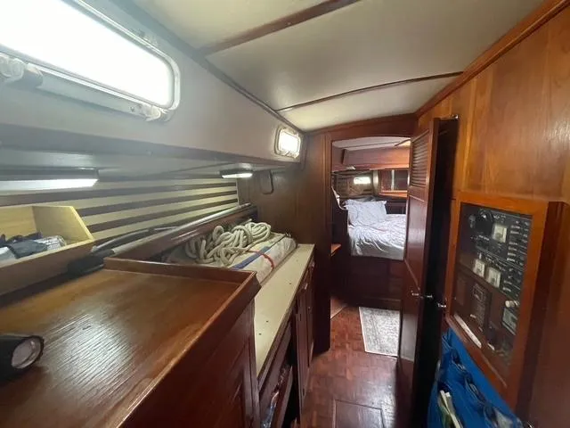Interior of 1981 Endeavour 43 Center Cockpit Ketch, featuring cozy cabin and wooden finishes.