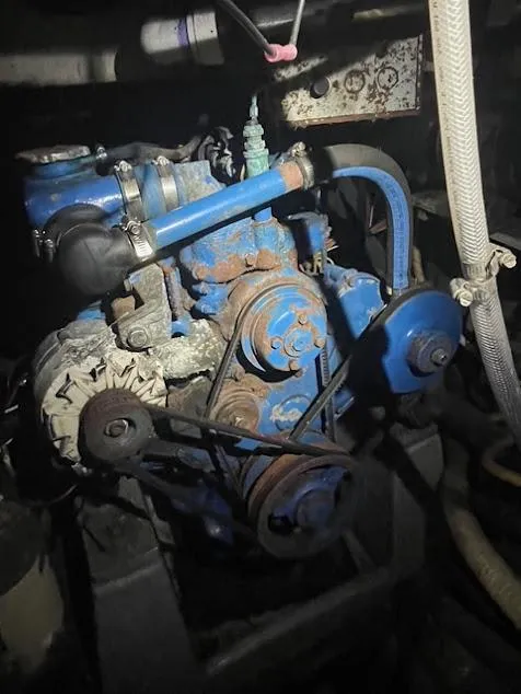 Engine of 1981 Endeavour 43 Center Cockpit Ketch, showing belts and pulleys.