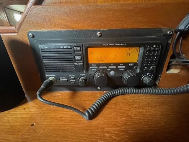 Marine radio transceiver on 1981 Endeavour 43 Center Cockpit Ketch, featuring Icom IC-M710 model.