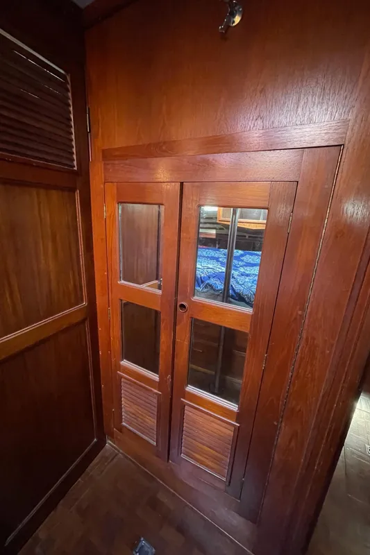 Wooden interior door on 1981 Endeavour 43 Center Cockpit Ketch yacht, showcasing classic nautical design.