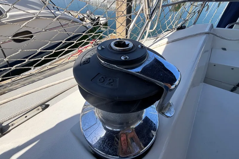 Winch on 1990 Catalina 42 sailboat deck, near marina.