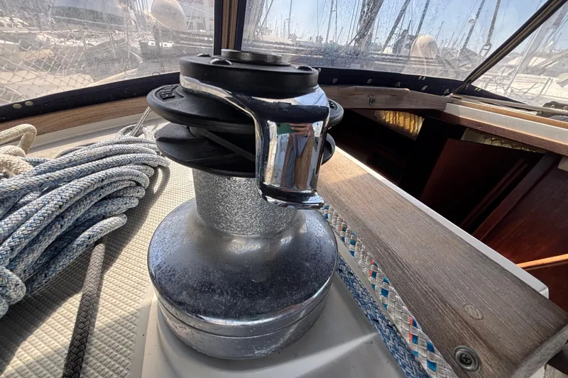 Winch and ropes on a 1990 Catalina 42 sailboat deck.