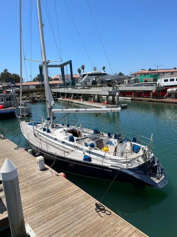 Sailing yacht Nautor Swan 46 MK II, 1994, docked in a sunny marina.