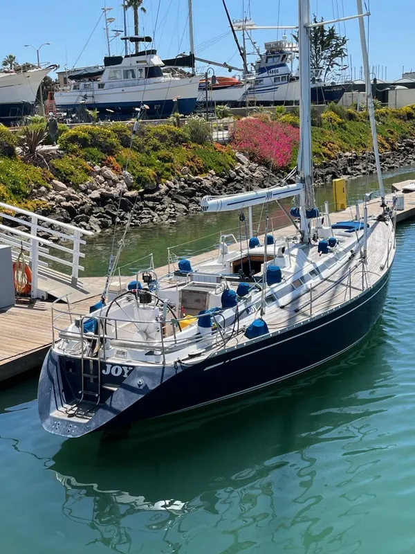 Sailing yacht Nautor Swan 46 MK II, 1994, docked in a sunny marina.
