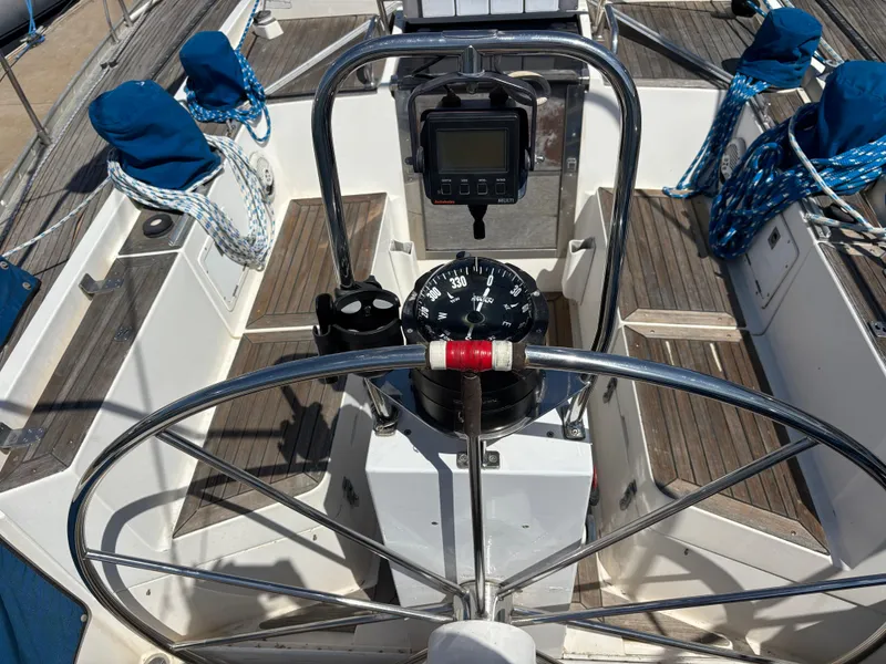 Cockpit of 1994 Nautor Swan 46 MK II sailboat with steering wheel and navigation instruments.