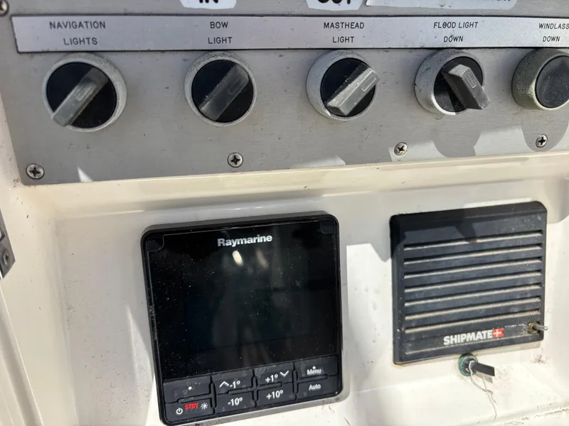 Control panel of a 1994 Nautor Swan 46 MK II yacht with Raymarine and Shipmate devices.