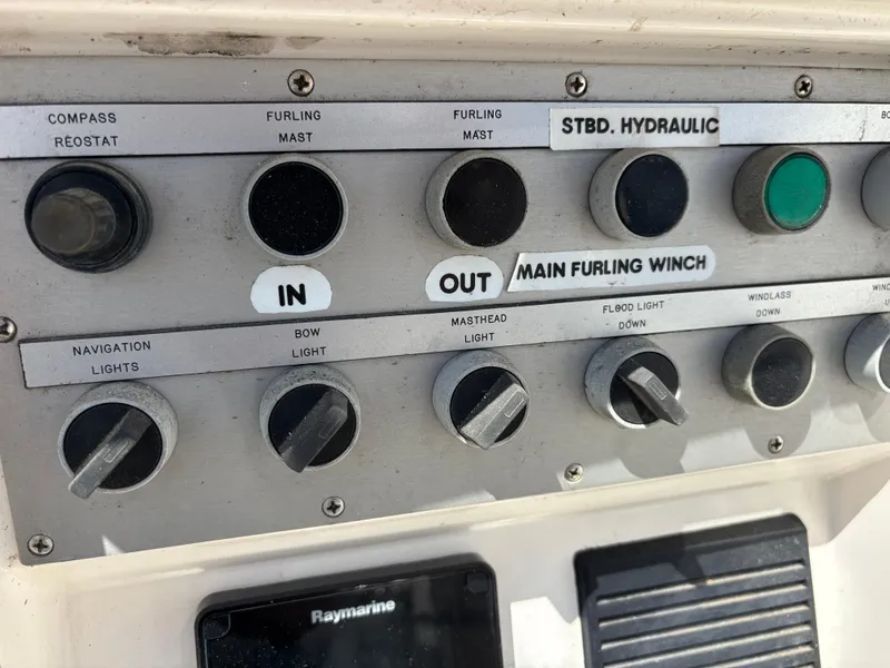 Control panel of a 1994 Nautor Swan 46 MK II sailboat, featuring various switches and dials.