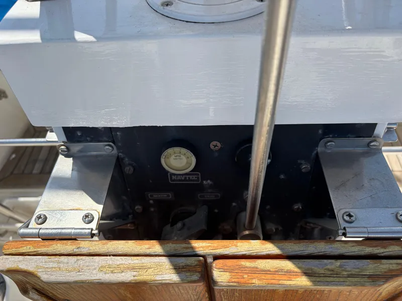 Control panel of 1994 Nautor Swan 46 MK II yacht, featuring metal and wood elements.