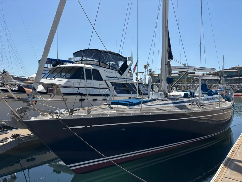 Sailing yacht Nautor Swan 46 MK II, 1994 model, docked at marina under clear sky.