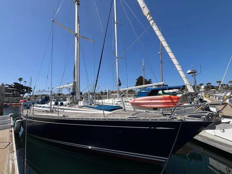 Sailing yacht Nautor Swan 46 MK II, 1994, docked in a marina under clear blue skies.