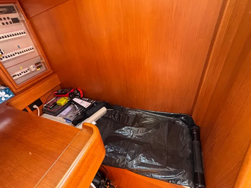 Nautor Swan 46 MK II 1994 yacht interior with wooden paneling and navigation equipment.
