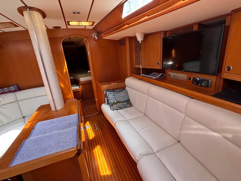 Luxurious interior of 1994 Nautor Swan 46 MK II yacht with white leather seating.