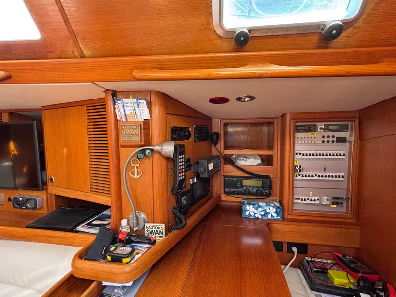 Navigation station of 1994 Nautor Swan 46 MK II yacht with communication equipment.