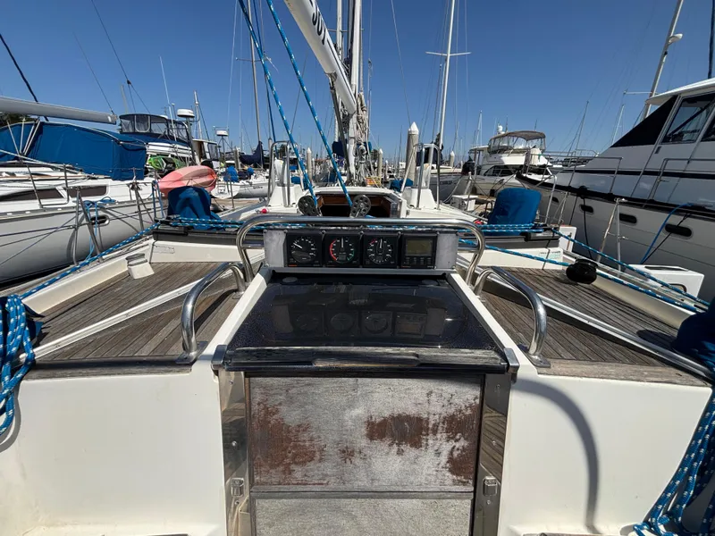 Cockpit view of 1994 Nautor Swan 46 MK II yacht, docked in a marina.