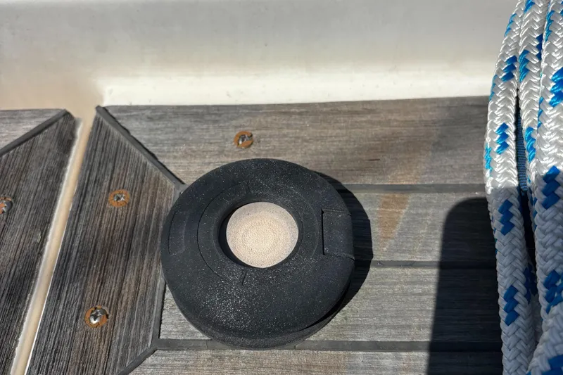 Deck detail of 1994 Nautor Swan 46 MK II with rope and circular fixture.