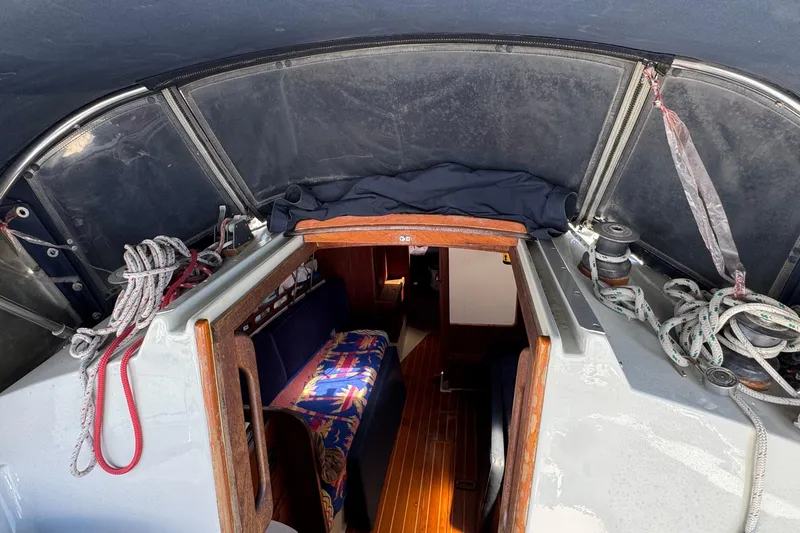 1989 Ericson Sloop interior view with ropes and colorful seating.
