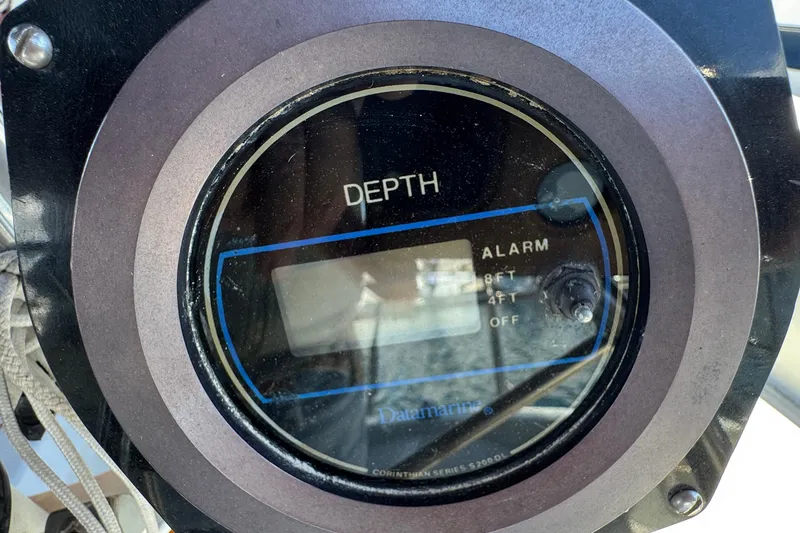 Depth gauge on 1989 Ericson Sloop, displaying alarm settings for 8ft, 4ft, and off.