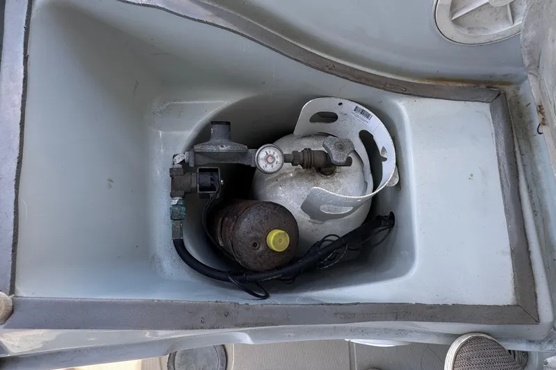 Propane tank storage compartment on a 1989 Ericson Sloop sailboat.