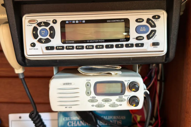 Control panel with Jensen and Uniden radios on a 1989 Ericson Sloop.