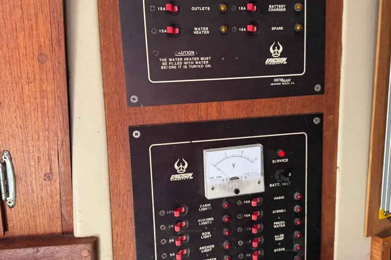 Electrical panel on a 1989 Ericson Sloop, featuring switches and a voltmeter.