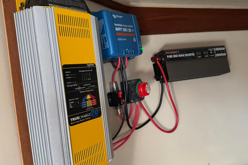 Electrical system setup on a 1989 Ericson Sloop, featuring charger and inverter.