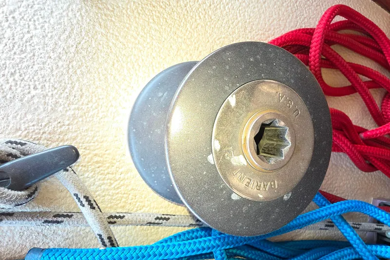 Winch on 1978 Islander Freeport 41 sailboat with colorful ropes.