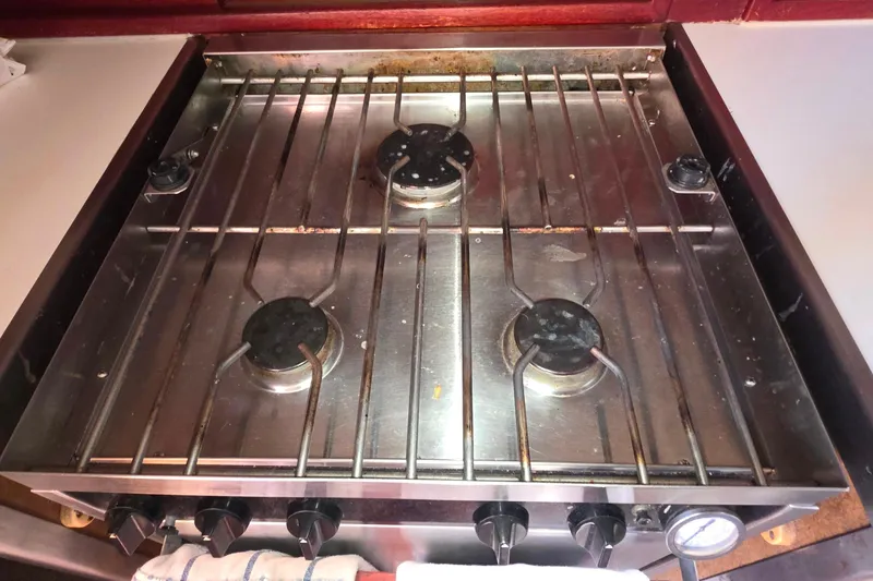 Stainless steel stove with four burners on a 1978 Islander Freeport 41 yacht.